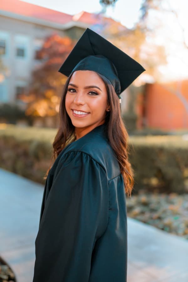 Smiling graduate who studied abroad after taking IELTS